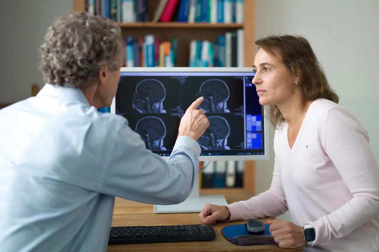 Neurologist reviewing brain scan images